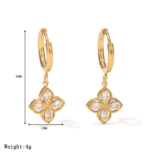 Aros dorados con dije de flor