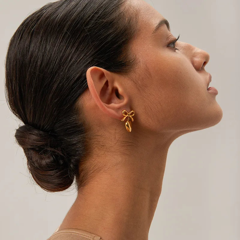 Bow & heart golden earrings